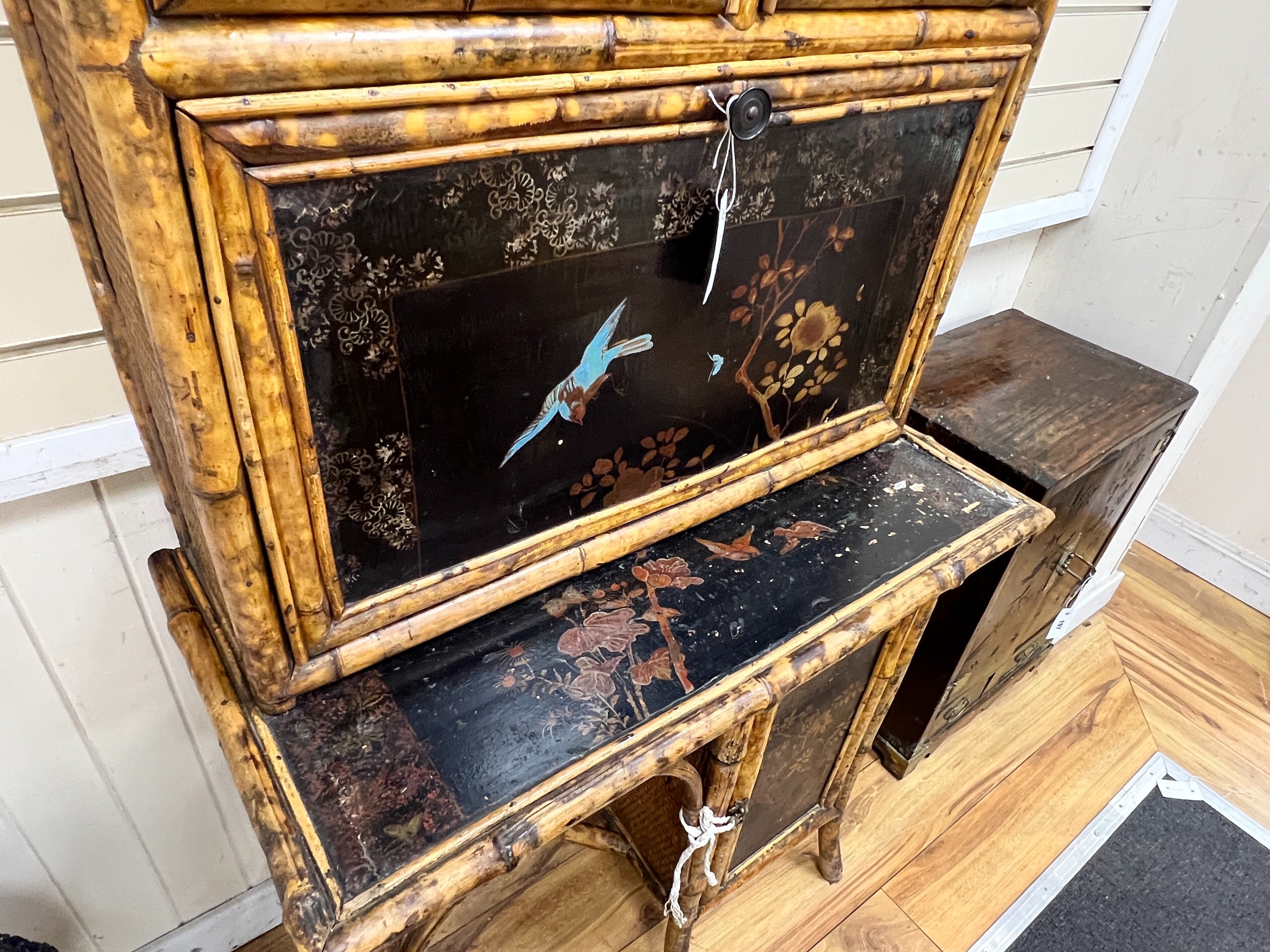 A late Victorian chinoiserie lacquer glazed bamboo writing cabinet with fall front compartment, width 76cm, depth 41cm, height 187cm